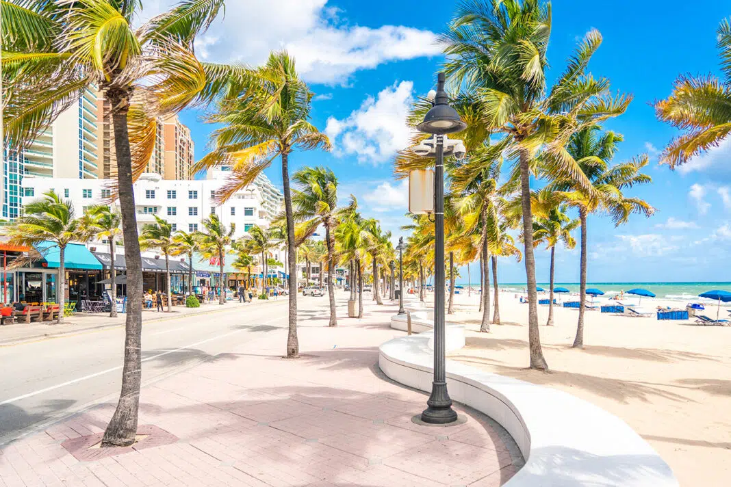 Fort Lauderdale, Florida, USA - September 20, 2019: Seafront beach promenade with palm trees on a sunny day in Fort Lauderdale