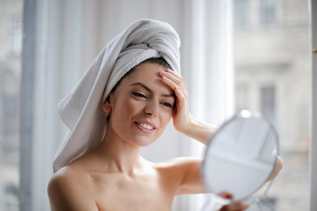 Woman taking care of her skincare. Photo by Andrea Piacquadio via pexels