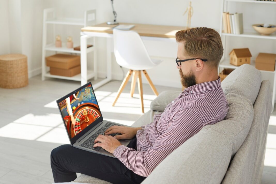 Playing roulette online. Photo via istock