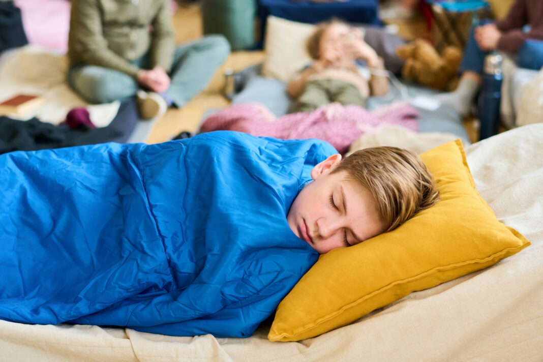 Kids sleeping bags to keep warm at night. Image by Getty Images via unsplash