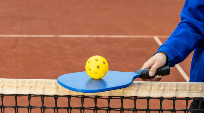 Elevating Your Game: The Perks of Stylish and Sweat-Resistant Pickleball Gear Playing Pickleball. Photo by Aleksander Saks via unsplash