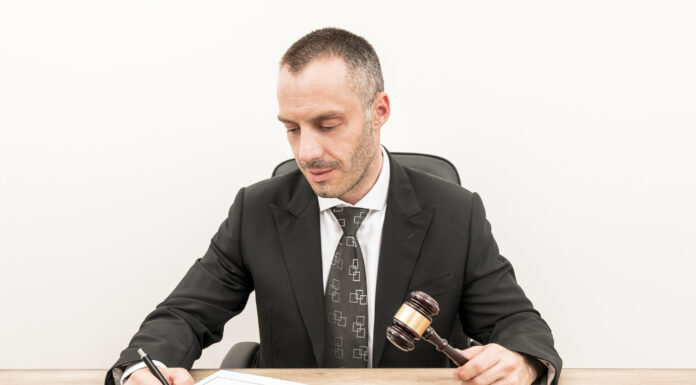 Timeline of a Partition Lawsuit: From Filing to Resolution A Lawyer fililng documents in court for a partition lawsuit. Photo via freepik