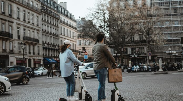 Top Features to Look for in a New Electric Scooter Two people riding an electric scooter on the streets. Photo by Vlad B on unsplash