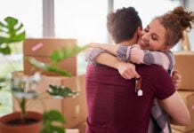 A Couple happy and able to create a budgeting plan. Photo via freepik from gpointstudio