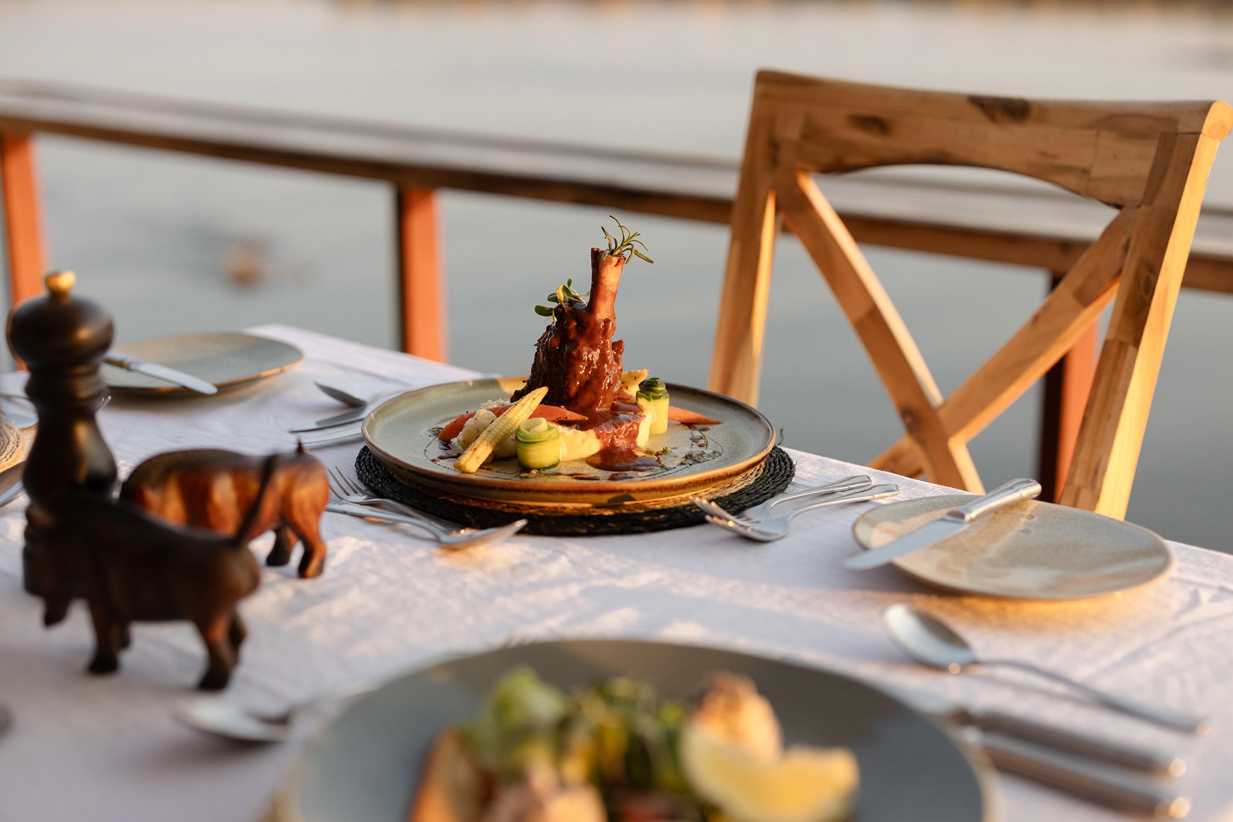 The lamb shank is absolutely delicious! Photo courtesy of Green Safaris | Sausage Tree Camp The lamb shank is absolutely delicious! Photo courtesy of Green Safaris | Sausage Tree Camp