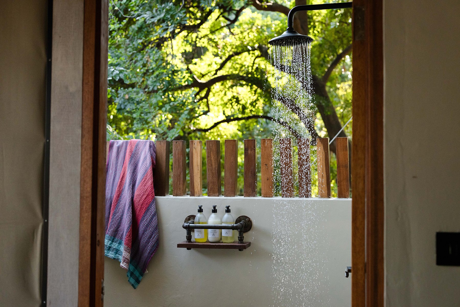 Have a post-workout outside shower. Photo courtesy of Green Safaris | Sausage Tree Camp Have a post-workout outside shower. Photo courtesy of Green Safaris | Sausage Tree Camp
