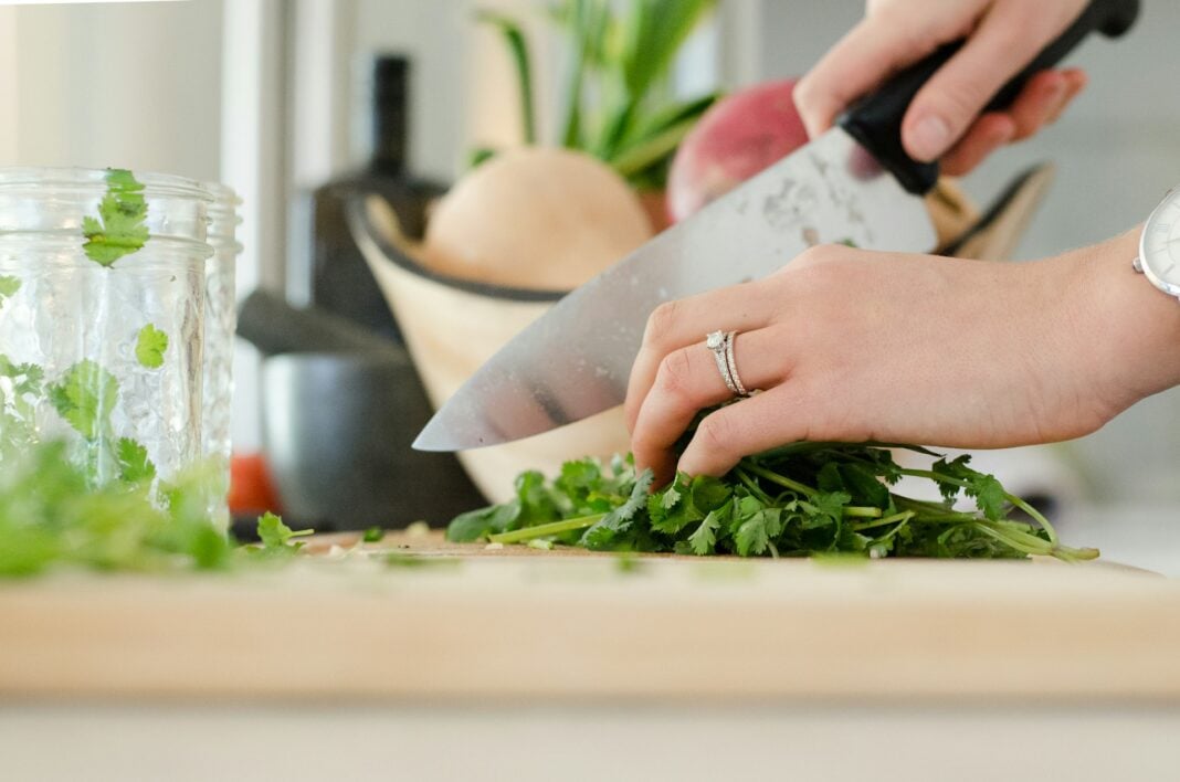 Working on her cooking skills at Home. Photo by Alyson Mcphee via unsplash