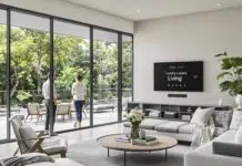Expansive modern luxury living room with indoor-outdoor flow and 'Luxury Living' on smart display. Photo courtesy of AI thru babylovegrowth.ai