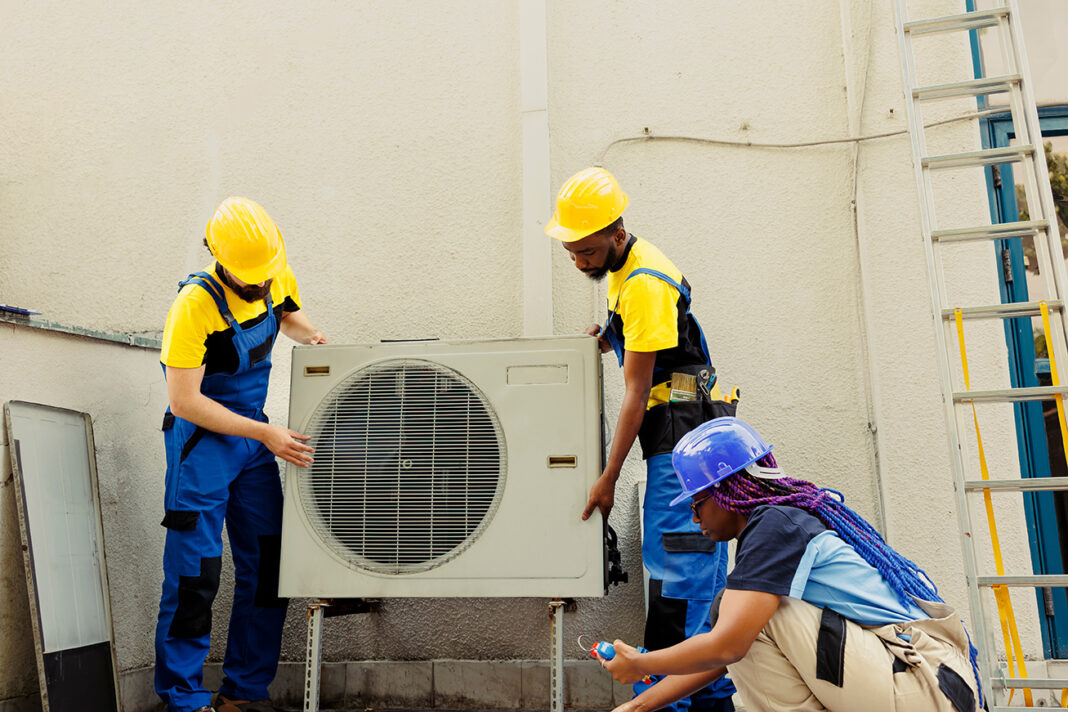 Air Conditioning problems getting fix by technicians. Photo by DC Studio via adobe stock