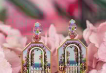 Miniature painting earrings depicting white archway and pink flowers
