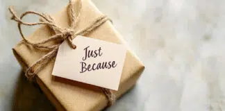 A small wrapped gift with a tag reading "Just Because" on a neutral background, with space for World Kindness Day messages. Photo source Adobe free Stock