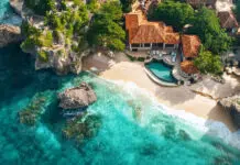 Luxurious resort nestled on a secluded beach with crystal-clear turquoise water, embracing island paradise