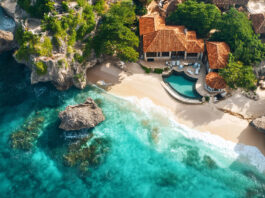 Luxurious resort nestled on a secluded beach with crystal-clear turquoise water, embracing island paradise