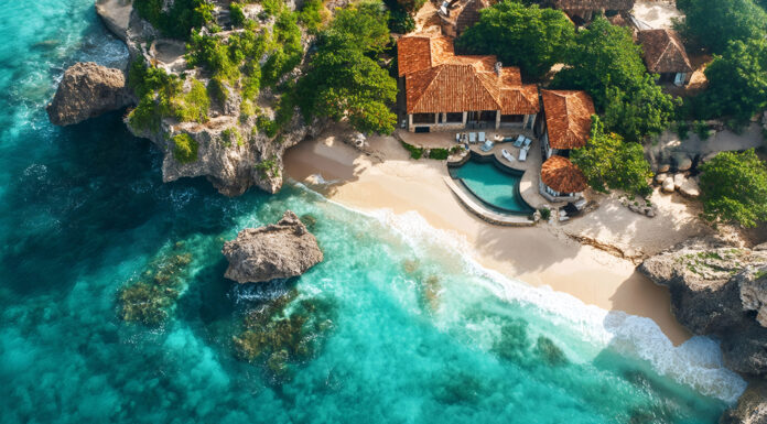 Top 10 Ultra-Luxury Private Islands for Exclusive Getaways Luxurious resort nestled on a secluded beach with crystal-clear turquoise water, embracing island paradise