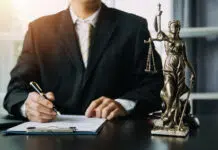 Business and lawyers discussing contract papers