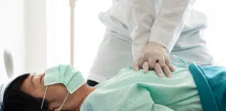 a doctor performing CPR on a patient