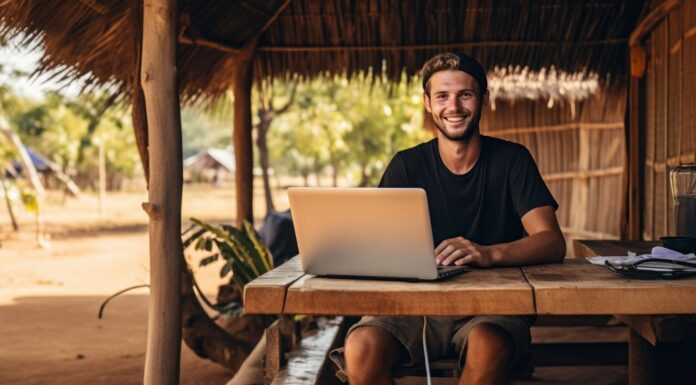 Multi-Currency Accounts: The Backbone of Digital Nomad Finances digital nomad working on the laptop at Laos