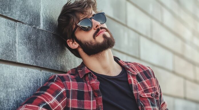 Why Every Gentleman Needs a Signature Pair of Sunglasses men wearing a nice pair of sunglasses. Photo courtesy of Andrii Lomako