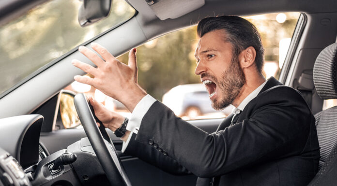 States With the Meanest Drivers angry businessman stuck in traffic, late to airport