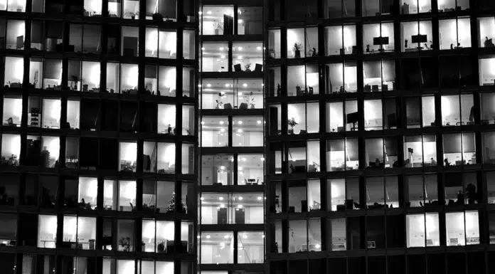 The New Neighborhood Hustle: How to Launch a Business Where People Live and Work pattern-of-office-buildings-windows-illuminated-at-night