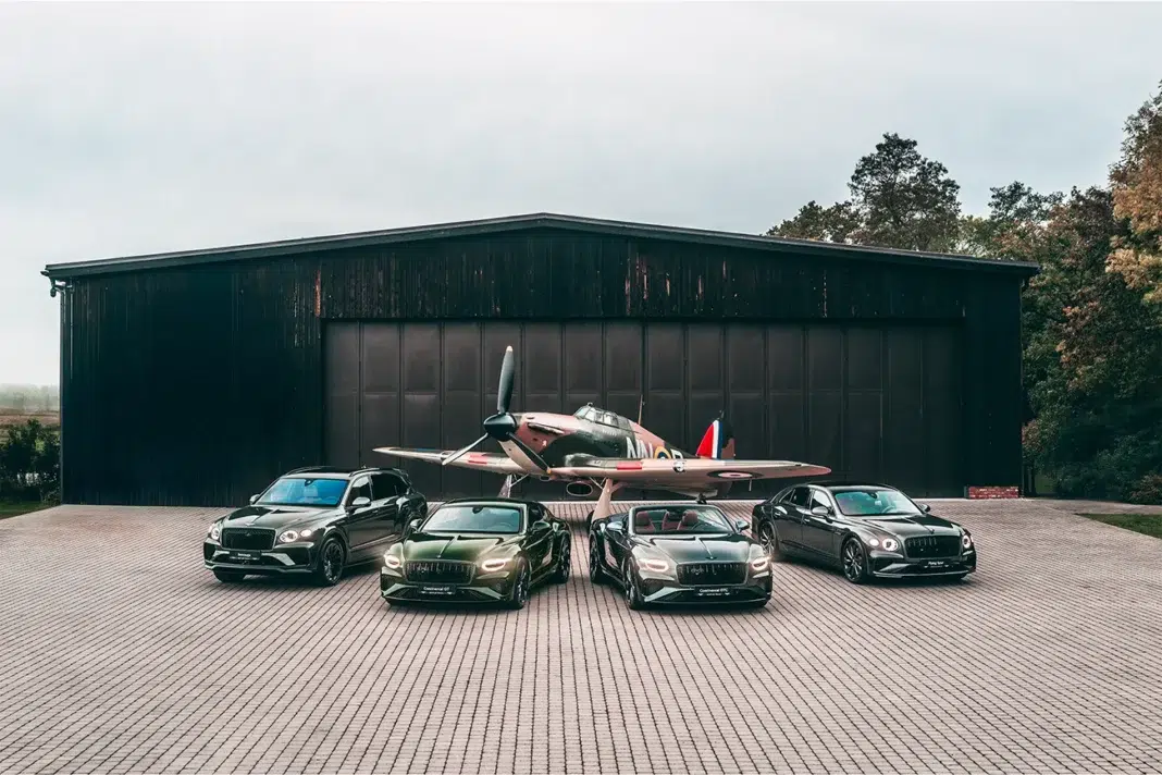 Bentley Czech Squadron Collection displayed with RAF World War II fighter aircraft in front of airfield hangar
