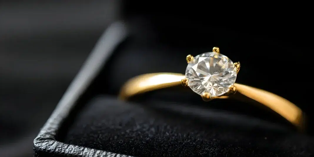 A beautiful sparkling gold engagement ring. photo via vecteezy A beautiful sparkling gold engagement ring. photo via vecteezy