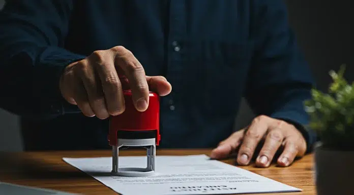 How Pasadena Document Apostille Services in California Assist in Marriage, Birth, and Education Certificates A men stamping a document in Pasadena California providing Apostille Services to his client