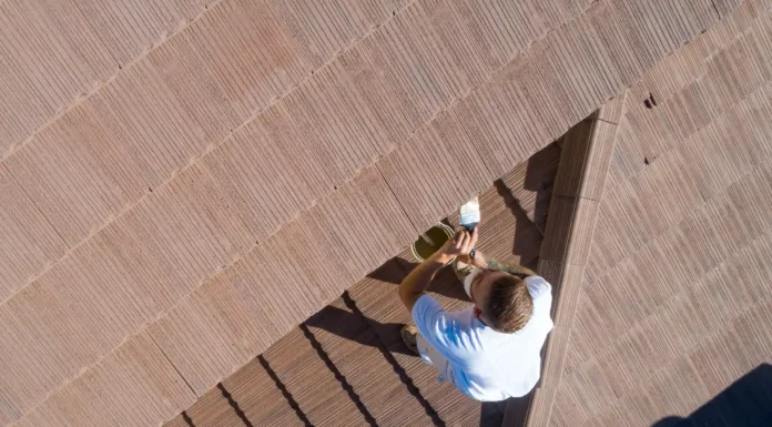 How Seasonal Maintenance Reduces the Need for Major Roof Repair A Professional is keeping the perfect maintenance on his home roof. Photo vecteezy-medium