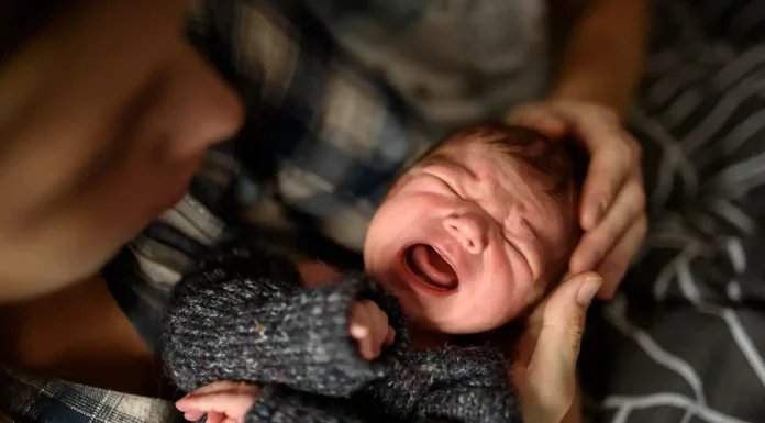 When Baby Sounds Like a Tiny Dragon: A Parent’s Guide to Newborn Congestion a mother taking care of her newborn congestion. Photo vecteezy-medium