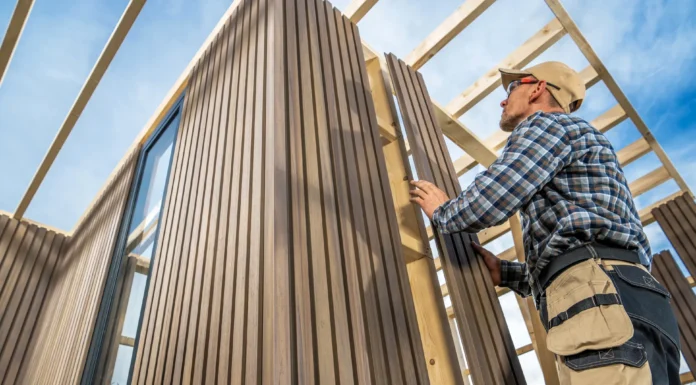 Key Benefits of Hiring a Professional Siding Contractor for Exterior Upgrades A Professional Siding Contractor working on a home. Vecteezy-medium
