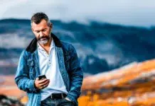 Everything You Need to Know About eSIM in New Zealand Modern man in New Zealand using his eSIM card. Vecteezy-medium
