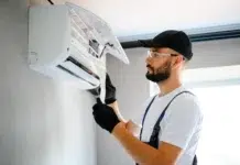 AC Repair Secrets: What Every Homeowner Must Know Before Calling Technician Doing some AC Repair. Vecteezy-medium