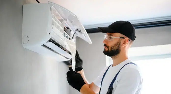 AC Repair Secrets: What Every Homeowner Must Know Before Calling Technician Doing some AC Repair. Vecteezy-medium