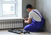 5 Essential Tips for Professional Heating Services at Home Young man working as a professional heating service contractor. Vecteezy-medium