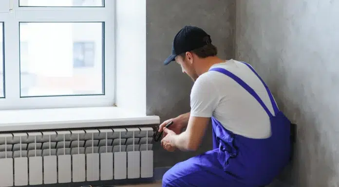 5 Essential Tips for Professional Heating Services at Home Young man working as a professional heating service contractor. Vecteezy-medium
