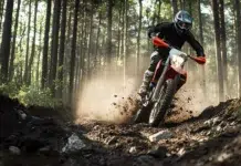 Electric Dirt Bikes Are Becoming a New Tool for Outdoor Exploration Dirt Motor Bike rider driving on dirt road in forest. Vecteezy-medium