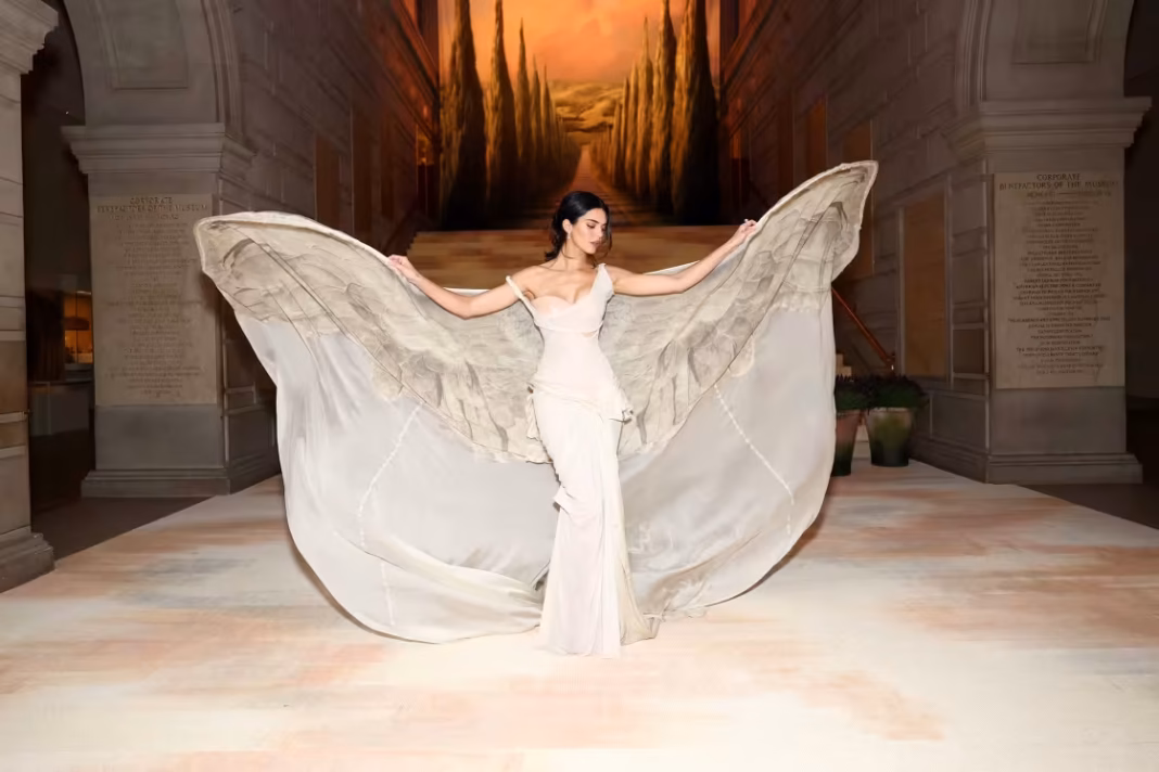 Kendall Jenner added a set of wings to her gown inside the 2026 Met Gala.Cindy Ord_MG26 _ Getty Images for The Met Museum_.jpg Kendall Jenner added a set of wings to her gown inside the 2026 Met Gala.Cindy Ord_MG26 _ Getty Images for The Met Museum_.jpg