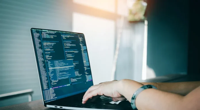 Leveraging Web Scraping for Smarter Price Comparison a person doing web scraping on his computer. Vecteezy-medium