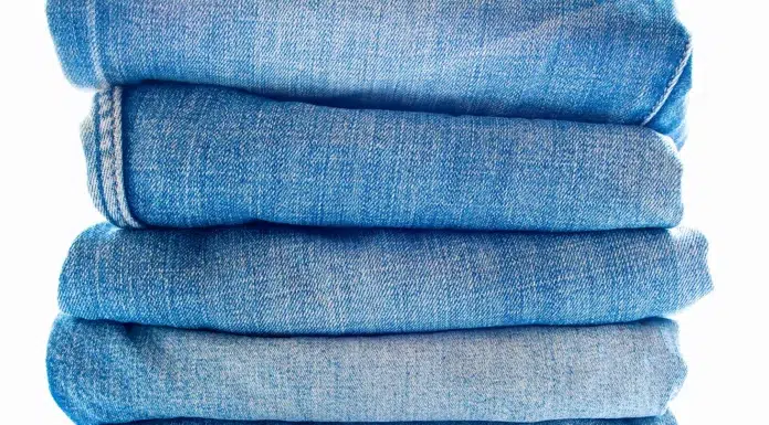 The Ultimate Jeans Buying Guide: Master Your Fit, Fabric, and Wash pile of blue jeans fabric texture. Vecteezy-medium