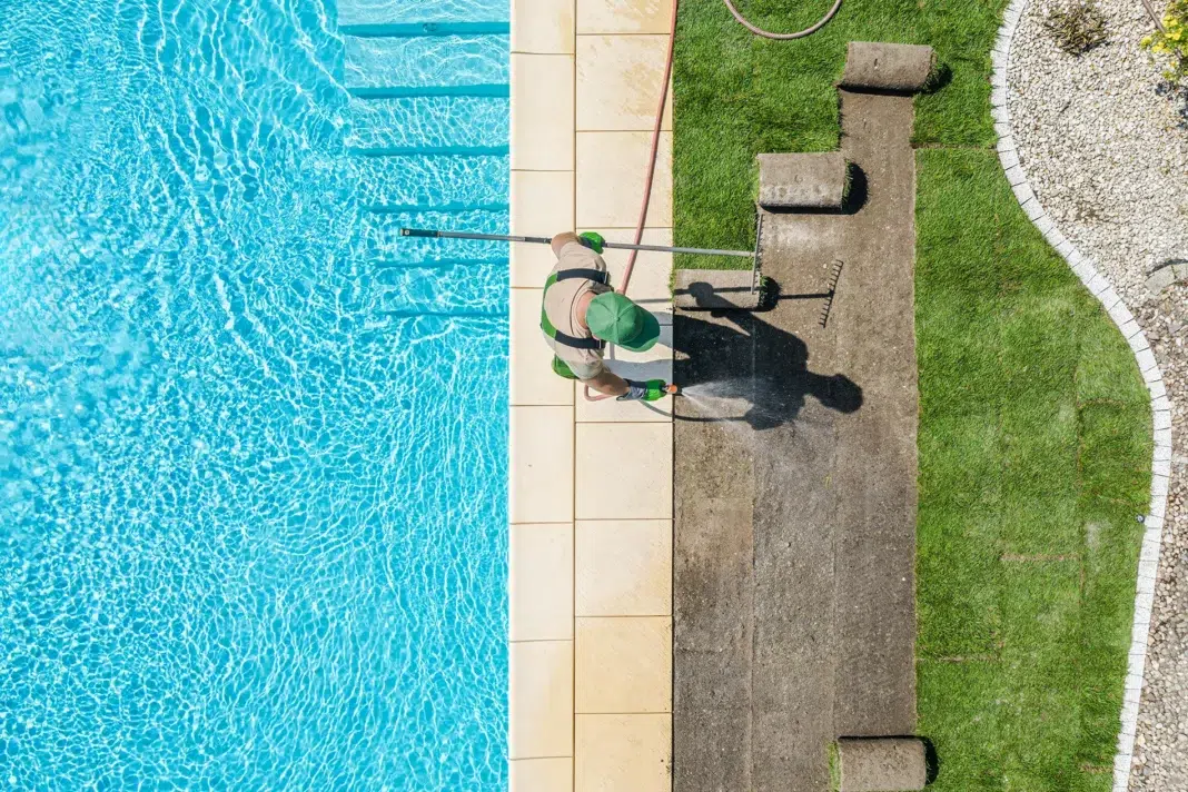 pool maintenance worker cleaning the pool. Vecteezy-medium pool maintenance worker cleaning the pool. Vecteezy-medium