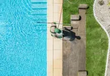 Why Pool Maintenance Feels Harder Than It Should Be pool maintenance worker cleaning the pool. Vecteezy-medium