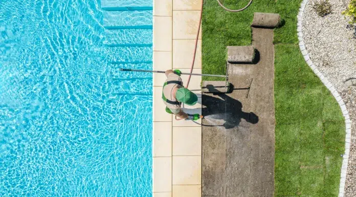 Why Pool Maintenance Feels Harder Than It Should Be pool maintenance worker cleaning the pool. Vecteezy-medium
