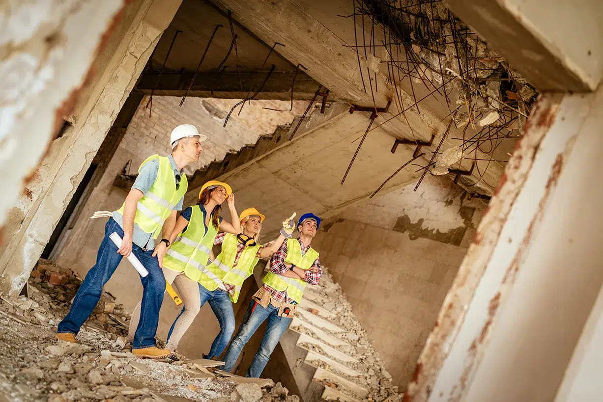 Female Engineers Inspecting a Demolished Wall.Vecteezy-medium Female Engineers Inspecting a Demolished Wall.Vecteezy-medium