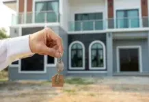 A Beginner’s Guide to Real Estate Investment: Multi-Family Properties Explained Person holding Silver Key with Clear Gemstone. Vecteezy-medium
