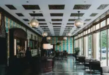 Boutique Hotel Management: A Guide for Owners Stylish boutique hotel lobby with warm modern. Photo by Steven Van Elk on unsplash