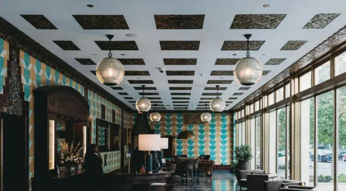 Boutique Hotel Management: A Guide for Owners Stylish boutique hotel lobby with warm modern. Photo by Steven Van Elk on unsplash