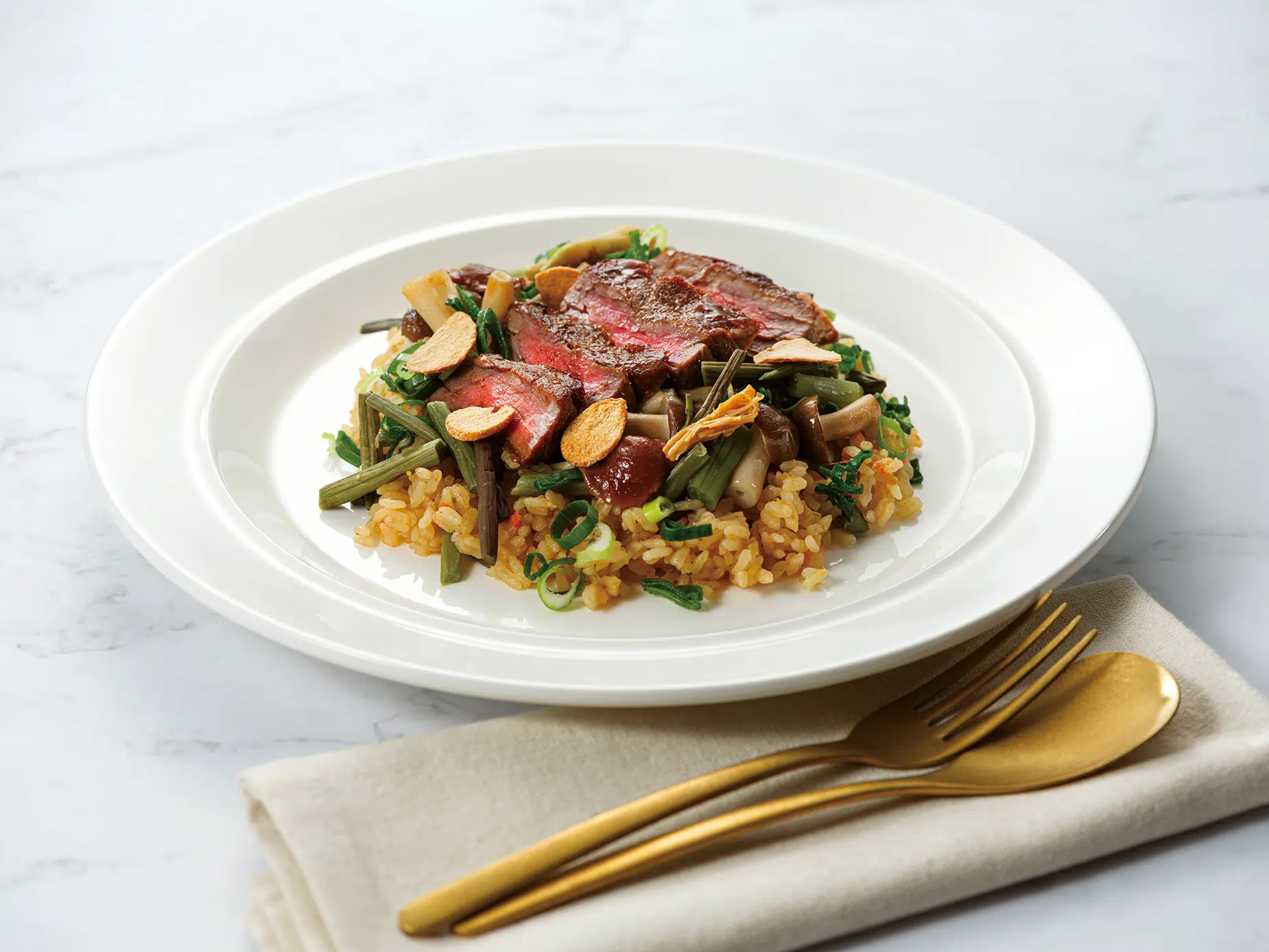 Wild Mountain Vegetable Pilaf with Beef Tenderloin. Photo courtesy of Imperial Hotel, Kyoto Wild Mountain Vegetable Pilaf with Beef Tenderloin. Photo courtesy of Imperial Hotel, Kyoto