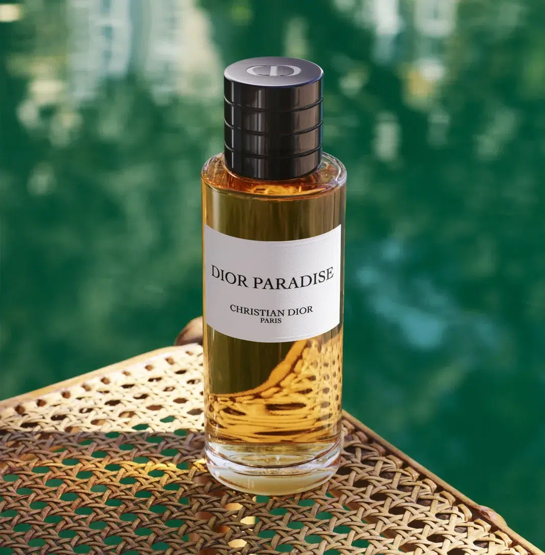 Dior Paradise perfume bottle beside a green pool Dior Paradise perfume bottle beside a green pool