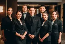 How an LMS for Hospitality Improves Staff Training Consistency Hospitality staff from LMS. Vecteezy-medium