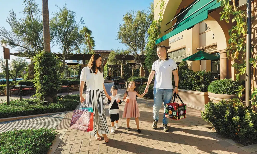 An Irvine family enjoys shopping in an outdoor mall. Photo courtesy of Irvine Standard An Irvine family enjoys shopping in an outdoor mall